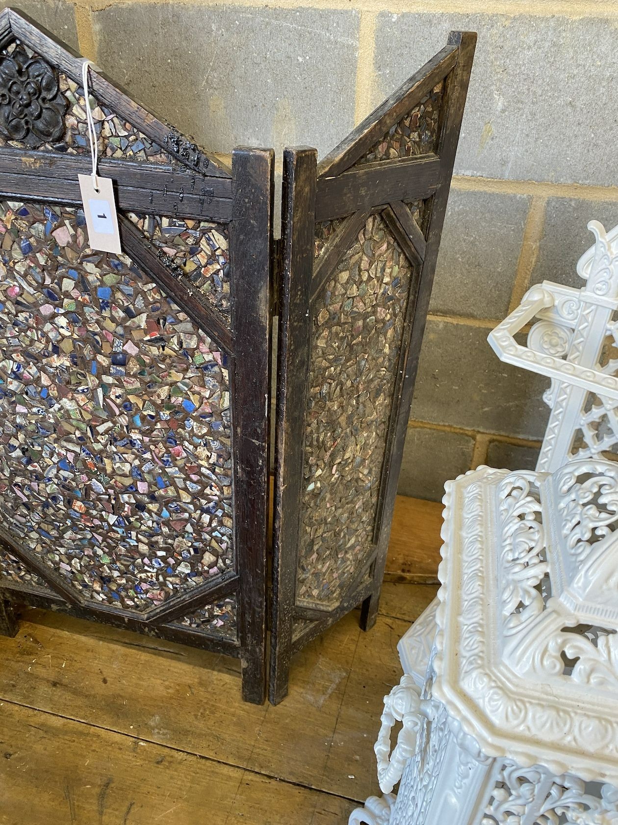 A carved oak and mosaic three-fold firescreen, height 86cm